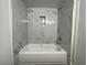 Bathroom with bathtub and marble-look tile at 4281 White Sands Ave, Las Vegas, NV 89121