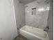 Bathroom with bathtub and marble-look tile at 4281 White Sands Ave, Las Vegas, NV 89121