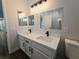 Modern bathroom with double vanity and walk-in shower at 8301 Boseck Dr # 119, Las Vegas, NV 89145