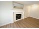 Bright living room with fireplace and wood-look floors at 8301 Boseck Dr # 119, Las Vegas, NV 89145