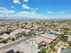 Wide aerial shot of the neighborhood with tidy streets and mountain views in the distance at 2130 Danzinger Pl, Henderson, NV 89044