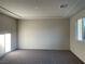 Large bedroom with neutral carpeting and ample natural light at , North Las Vegas, NV 89086