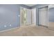 Bedroom with mirrored closet and neutral walls at 10294 Canvas Canyon Ct, Las Vegas, NV 89178