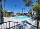 Community pool with lounge chairs and a waterfall feature at 8600 W Charleston Blvd # 2025, Las Vegas, NV 89117