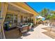 Relaxing patio with seating area, ceiling fan, and outdoor kitchen at 2290 Casa Bella Ct, Las Vegas, NV 89117