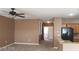 Spacious living room with neutral color palette and ceiling fan at 1423 Orange Jubilee Rd, Henderson, NV 89014