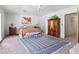 Spacious primary bedroom with large windows and an ensuite bathroom at 8245 Helena Ave, Las Vegas, NV 89129