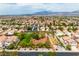 Aerial view of neighborhood with community park and open space at 8908 Tumblewood Ave, Las Vegas, NV 89143