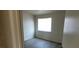 Simple bedroom with window and wood-look flooring at 2501 Charleville Ave # 104, Las Vegas, NV 89106