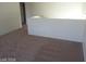 Spacious loft area with carpet and plenty of natural light at 5308 La Quinta Hills St, North Las Vegas, NV 89081