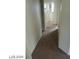 Hallway with carpet and doors leading to bedrooms and bathroom at 5308 La Quinta Hills St, North Las Vegas, NV 89081