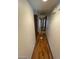 Long hallway with wood laminate flooring at 600 Woodmount Dr, Las Vegas, NV 89107