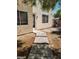 Landscaped backyard with paved walkway and access to home at 4821 Whisper Lake Ave, Las Vegas, NV 89131