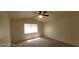 Bright bedroom with ceiling fan and carpet at 4821 Whisper Lake Ave, Las Vegas, NV 89131