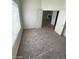 Bright bedroom with gray carpet and access to other rooms at 3640 Judson Ave, Las Vegas, NV 89115