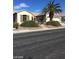 Ranch-style home with mature landscaping and a three-car garage at 2175 Clearwater Lake Dr, Henderson, NV 89044