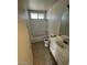 Bathroom with tub, toilet, and vanity at 5243 Sunnywood Dr, Las Vegas, NV 89120