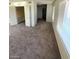 Large bedroom with neutral carpeting and ample closet space at 5243 Sunnywood Dr, Las Vegas, NV 89120