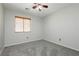 Spacious bedroom with ceiling fan and grey carpet at 6045 Crystal Talon St, Las Vegas, NV 89130