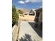 Large backyard with concrete patio and mountain views at 6030 Halehaven Dr, Las Vegas, NV 89110