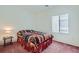 Cozy bedroom featuring a full-size bed and window at 2220 Carrier Dove Way, North Las Vegas, NV 89084