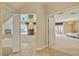 Elegant hallway with views into spacious bedroom and backyard pool area at 4156 Balmoral Castle Ct, Las Vegas, NV 89141