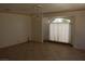 Spacious living room featuring a bay window and tile floors at 6687 Atwood Ave, Las Vegas, NV 89108