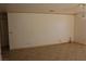 Bright living room with tile floors and a chandelier at 6687 Atwood Ave, Las Vegas, NV 89108