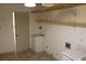 Bright laundry room with cabinets and extra shelving at 6687 Atwood Ave, Las Vegas, NV 89108