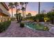 Sunset view of backyard oasis with inviting pool and patio at 8199 Pinnacle Peak Ave, Las Vegas, NV 89113