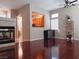 Living room with hardwood floors, fireplace and kitchen view at 1625 Pacific Tide Pl, Las Vegas, NV 89144