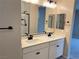 Double vanity bathroom with modern fixtures and a shower at 9880 Angel Valley Dr, Las Vegas, NV 89178