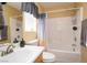 Clean bathroom with tub, shower, and wood vanity at , Las Vegas, NV 89122