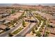 Aerial view of a gated community entrance with surrounding homes at 723 Orange Plume Walk # 0, Henderson, NV 89011