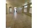 Spacious living room with tile flooring and neutral color scheme at 3656 Bella Legato Ave, North Las Vegas, NV 89081