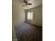 Simple bedroom with a window and ceiling fan at 3656 Bella Legato Ave, North Las Vegas, NV 89081