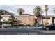 Front exterior with stone accents and desert landscaping featuring a car parked in front at 20 Olympia Canyon Way, Las Vegas, NV 89141