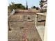 Large backyard with stairs leading up to a terraced area at 2813 Cacto Ct, Henderson, NV 89074