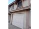 Exterior view of a two-story house with a white garage door at 2813 Cacto Ct, Henderson, NV 89074