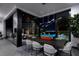 Modern dining room with sleek table and chairs near the pool at 581 Overlook Rim Dr, Henderson, NV 89012