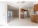 Kitchen and living area with tile floors and wood cabinets at 604 Jade Cir, Henderson, NV 89002