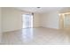 Bright living room with tile floors and sliding glass door at 604 Jade Cir, Henderson, NV 89002