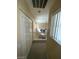 Upstairs hallway with double doors and a view of the lower level at 9801 Bradford Summit St, Las Vegas, NV 89183