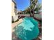 Inviting kidney-shaped pool with patio and lounge chairs at 9801 Bradford Summit St, Las Vegas, NV 89183