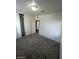 Spacious bedroom with neutral walls, carpet, and access to another room at 39 E Pacific Ave, Henderson, NV 89015