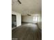 Large bedroom with grey vinyl flooring and view into bathroom at 1710 Shadow Mountain Pl, Las Vegas, NV 89108