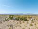 Aerial view showing a house with mountain views and desert landscape at 2441 Ottawa St, Sandy Valley, NV 89019