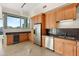 Modern kitchen with wood cabinets, stainless steel appliances and wine cooler at 360 E Desert Inn Rd # 1703, Las Vegas, NV 89109