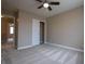 Spacious bedroom with ceiling fan and carpet at 3805 Conough Ln, Las Vegas, NV 89129