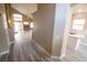 Bright entryway with wood-look floors leading to living and kitchen areas at 3805 Conough Ln, Las Vegas, NV 89129